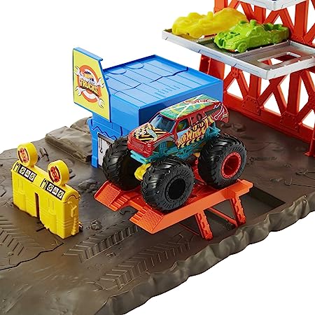 Hot Wheels - Monster Trucks Playset Distruzione Suprema e 3 Macchinine con Lanciatore, Giocattolo per Bambini 4+ Anni, HFB12